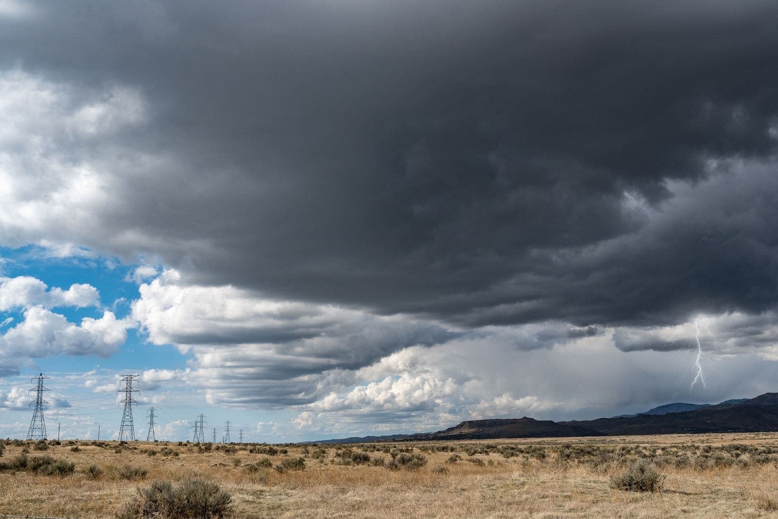 Dark storm clouds over dry open plains