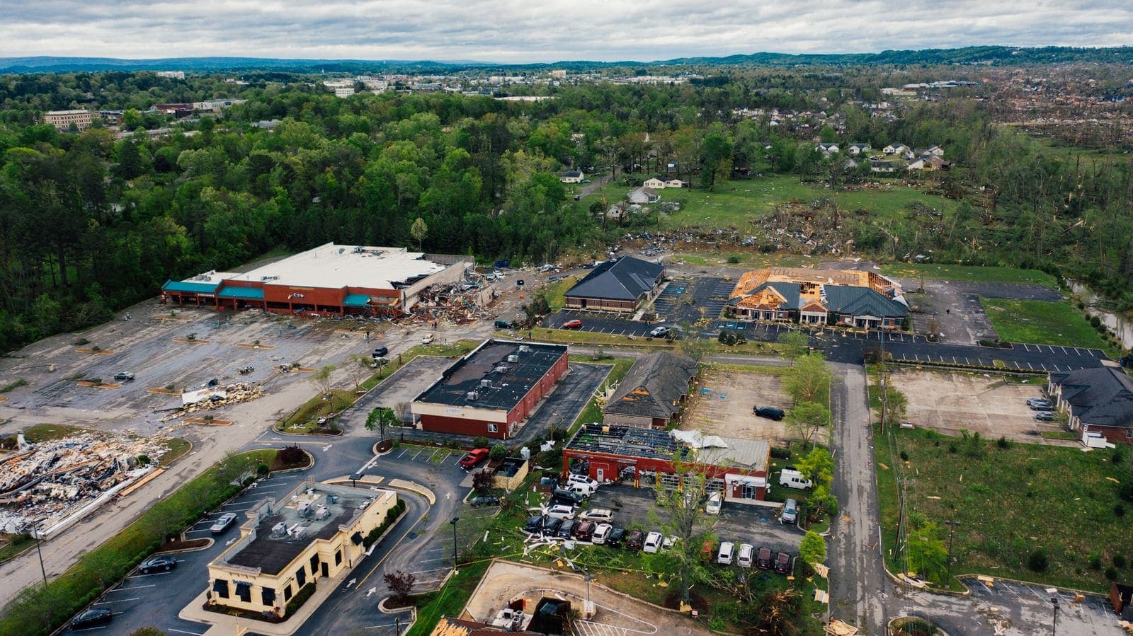 Aerial view of a town with roofs and buildings damaged by a severe storm