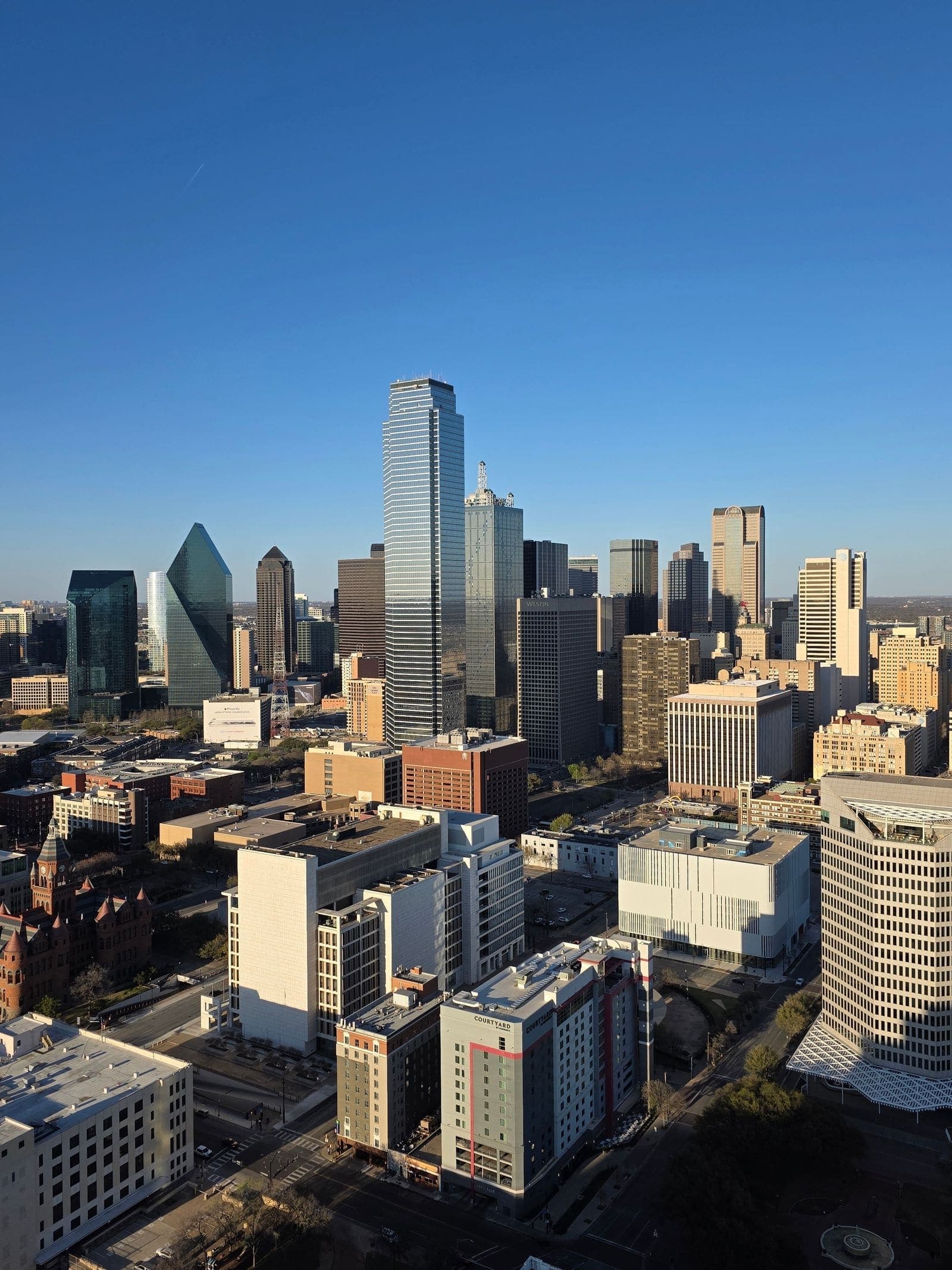 Downtown Dallas skyline under a blue sky